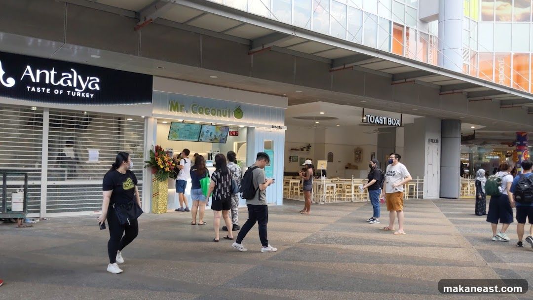 Outdoor food court with various shops