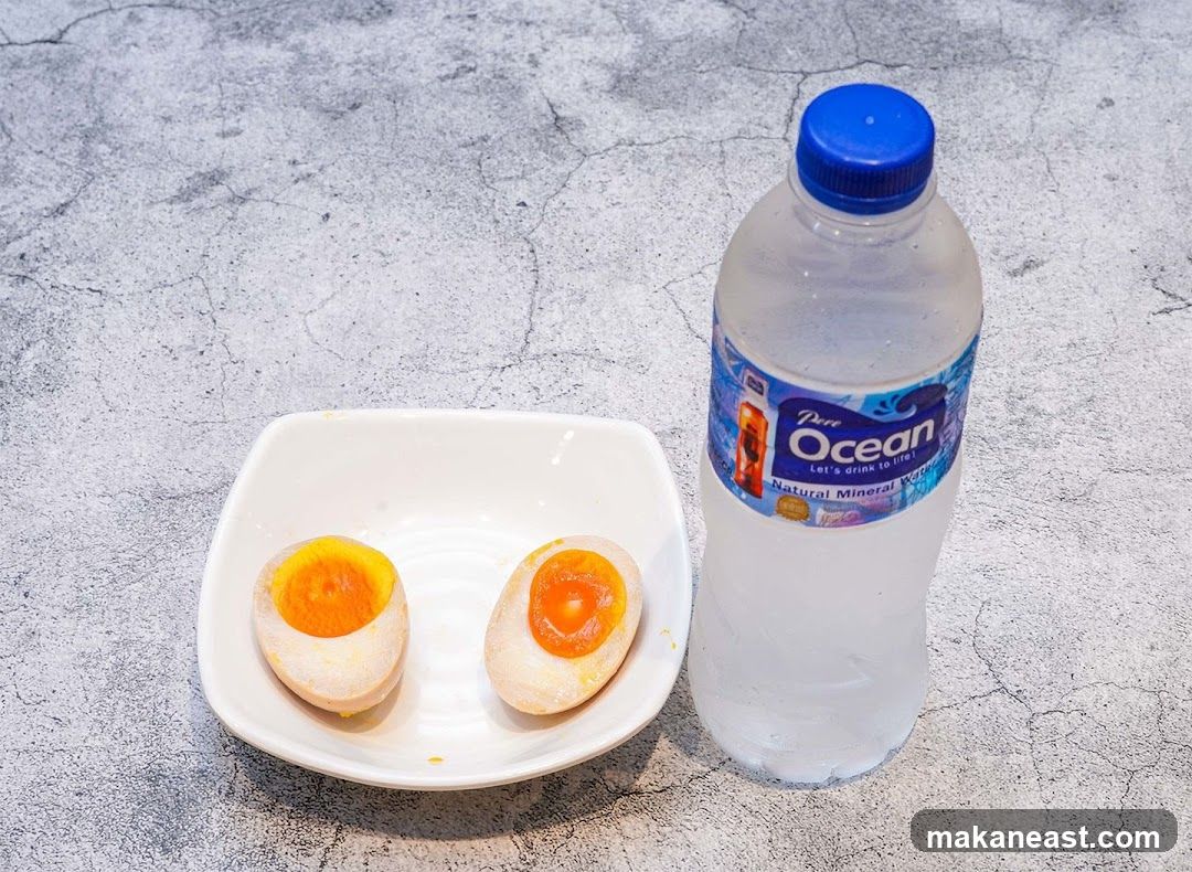 Two Halved Eggs and a Bottle of Water