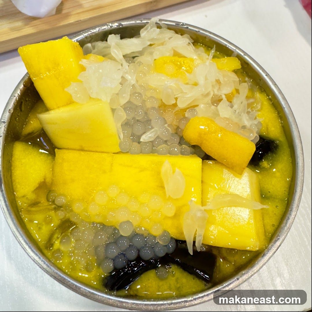 Mango dessert with boba and grass jelly