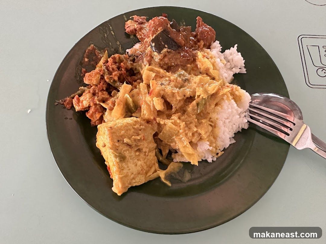 Plate of food with rice and various dishes