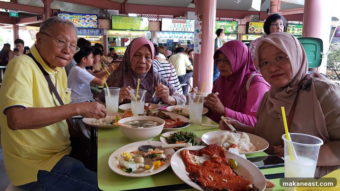 Family enjoying a meal at a food court