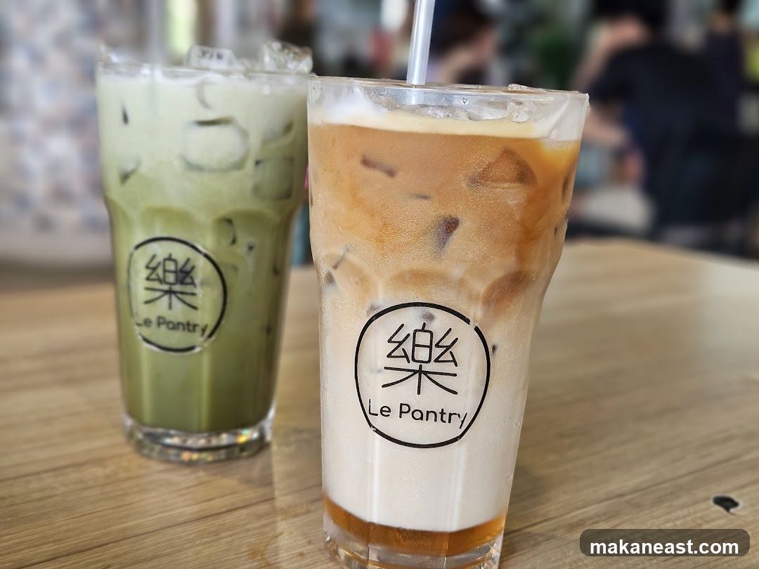 Two iced drinks on a wooden table