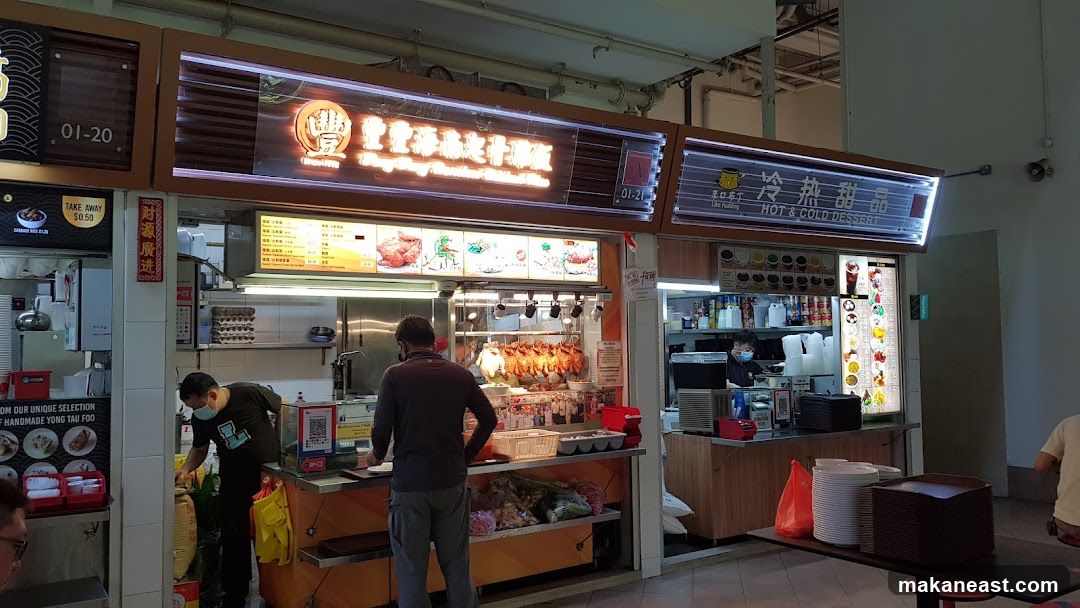Food Stall with Roasted Meats and Desserts