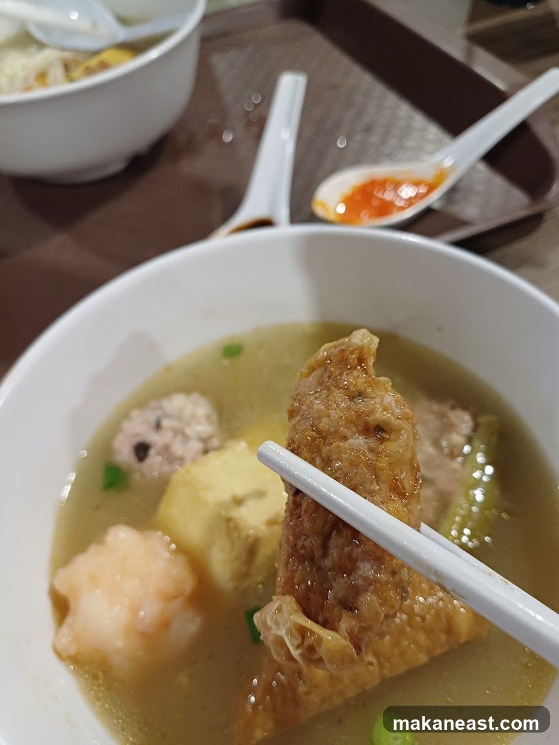 Close-up of a bowl of soup with various ingredients