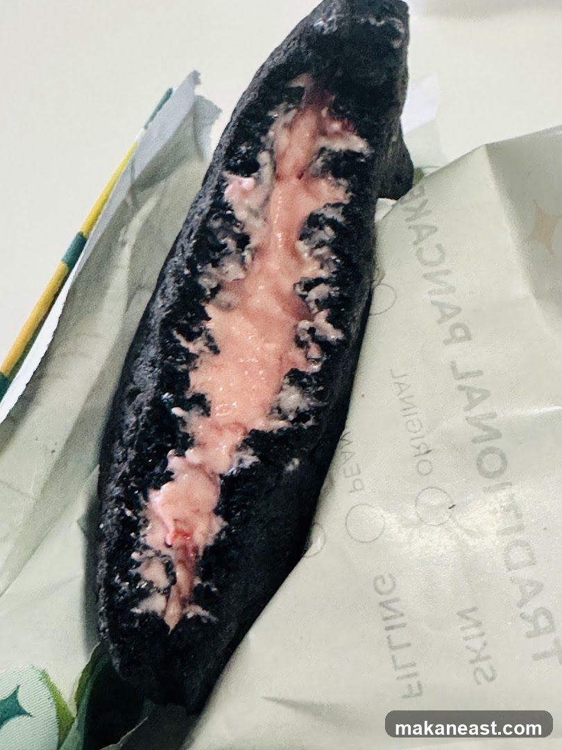 Black bun with pink filling