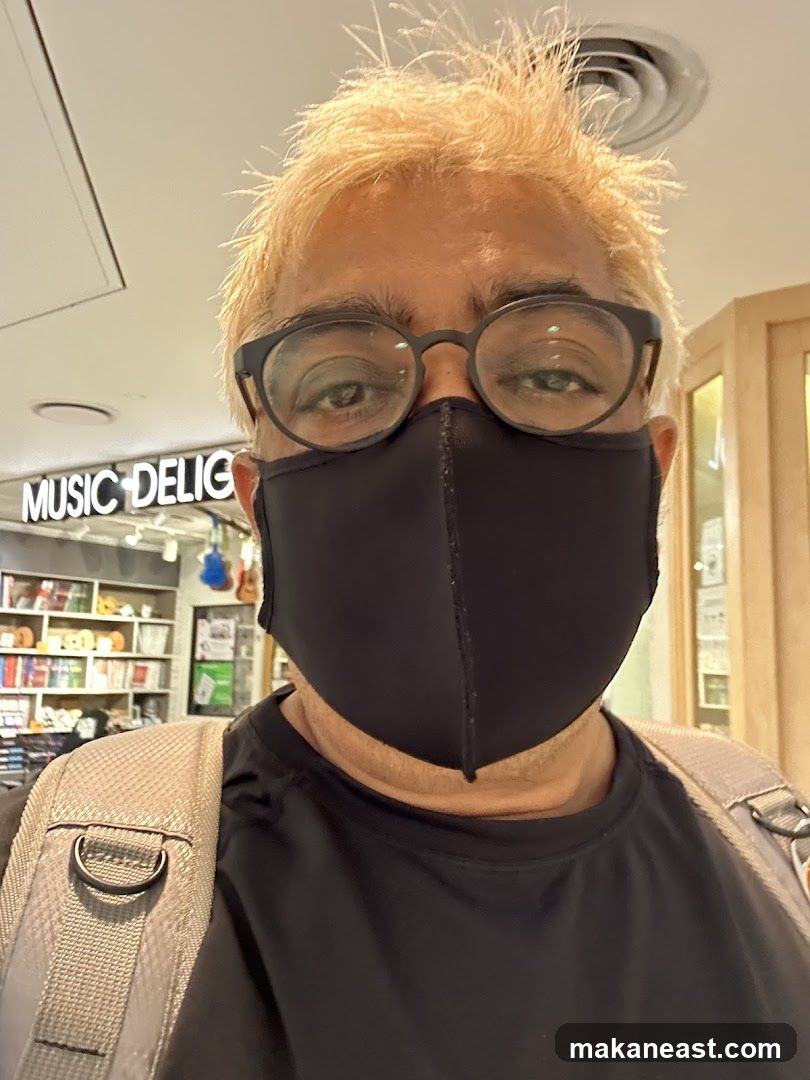 Person wearing a mask in front of a store