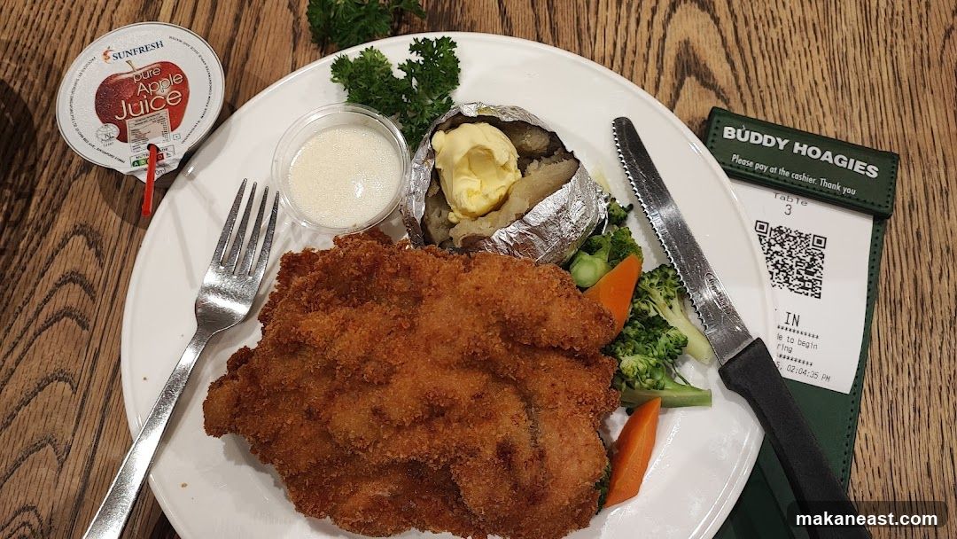 Breaded chicken with baked potato and vegetables