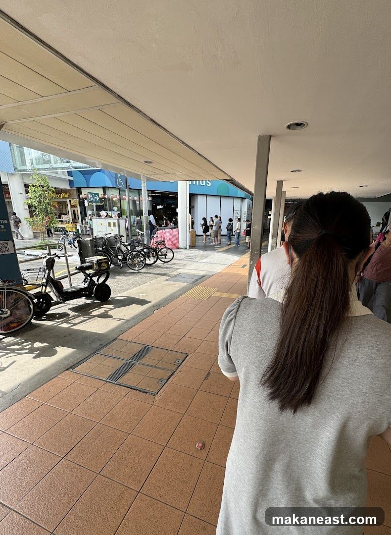 People queuing outside a store