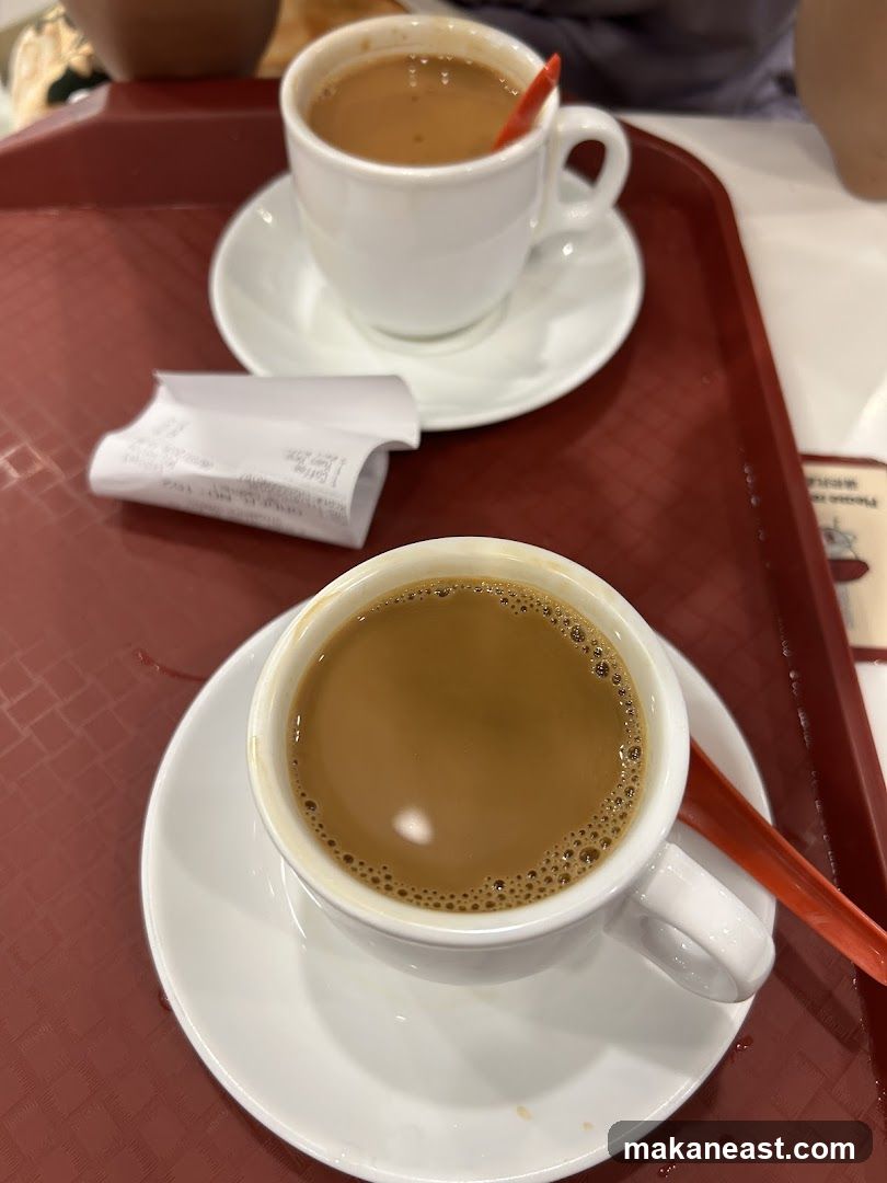 Two cups of coffee on a tray
