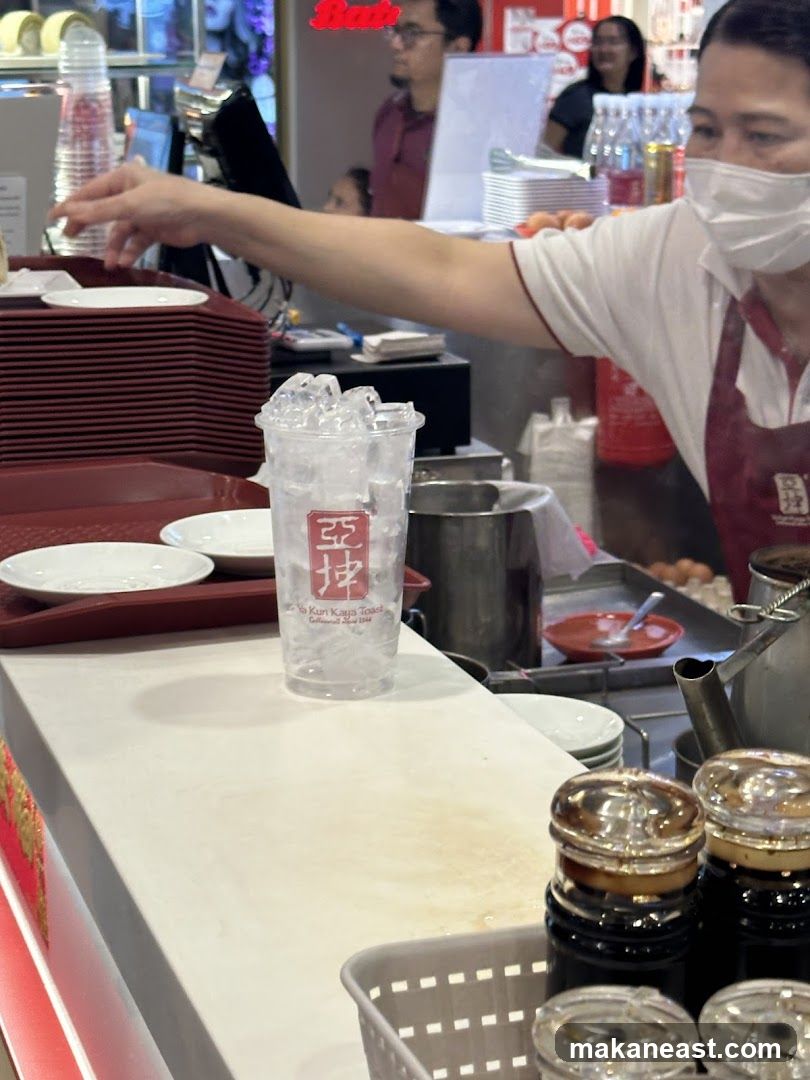 Counter with Ice-filled Cup and Condiments
