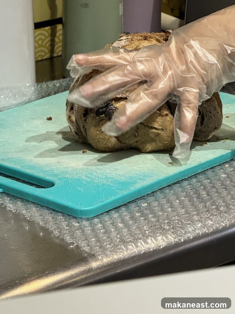 Gloved Hands Handling Bread