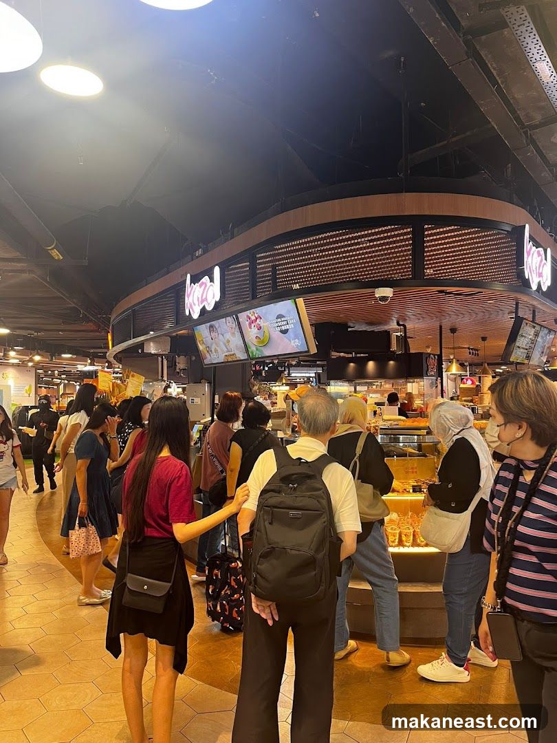People queuing at a food stall