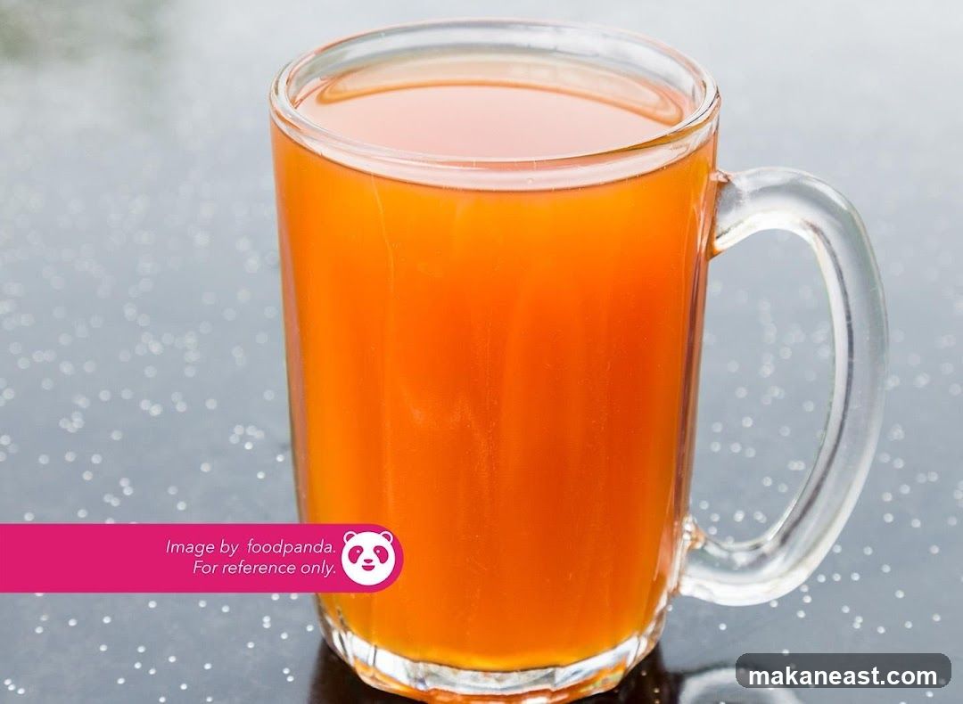 Orange Drink in a Glass Mug