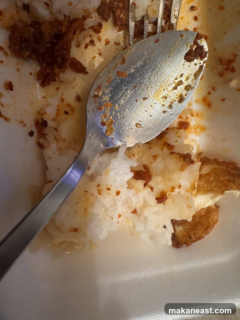Spoon and Fork with Leftover Food