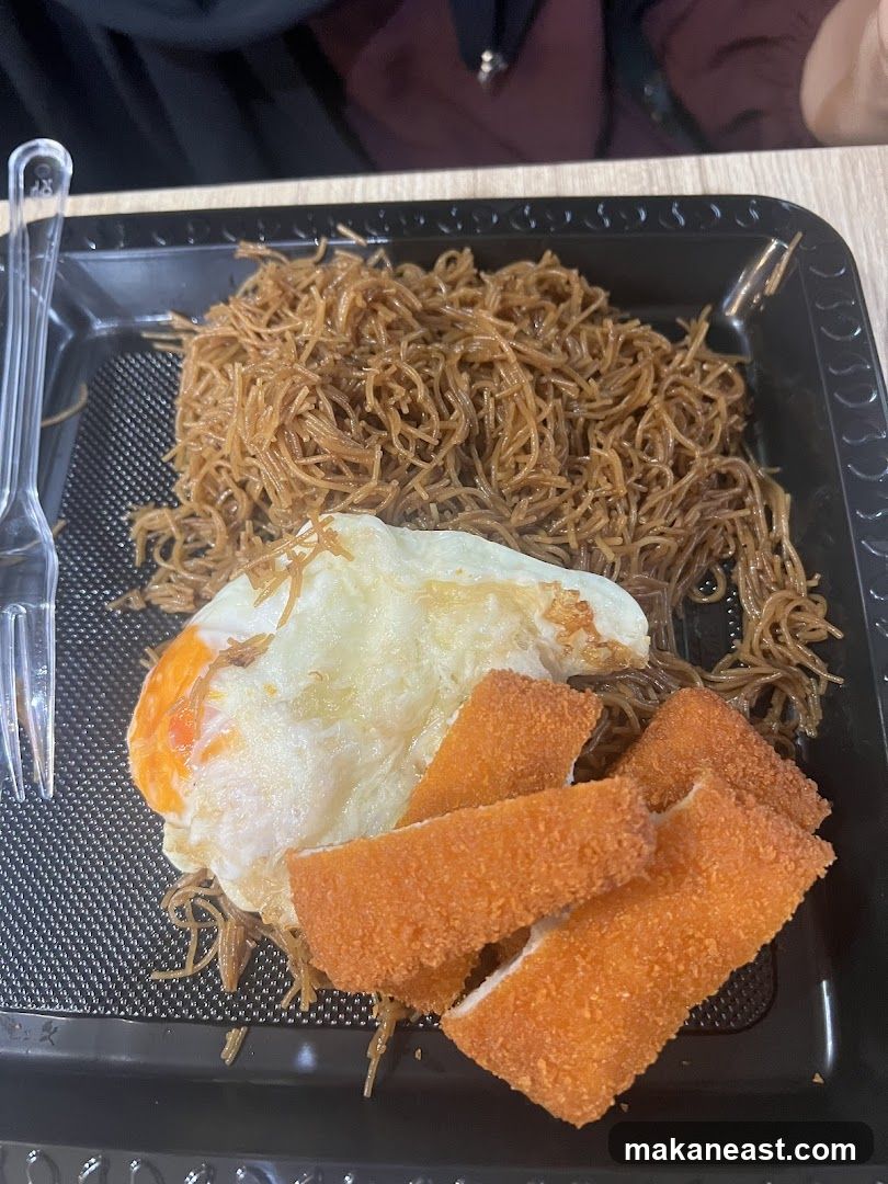 Fried Egg and Noodles with Chicken Strips