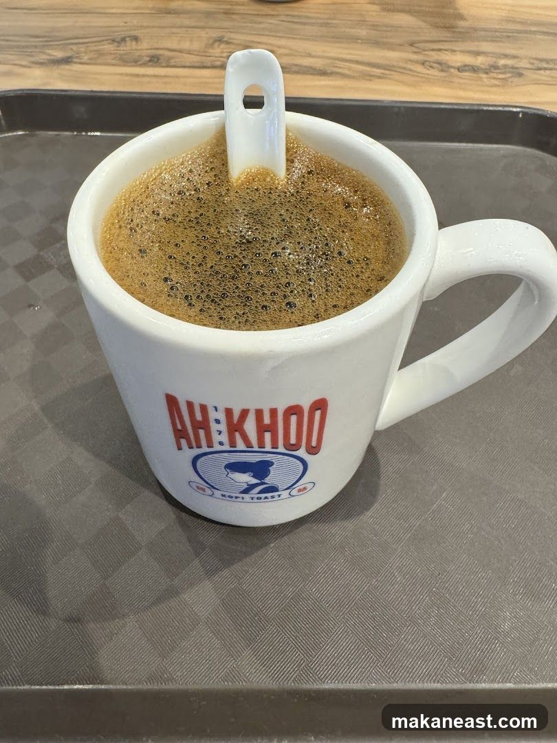 Coffee with foam and spoon