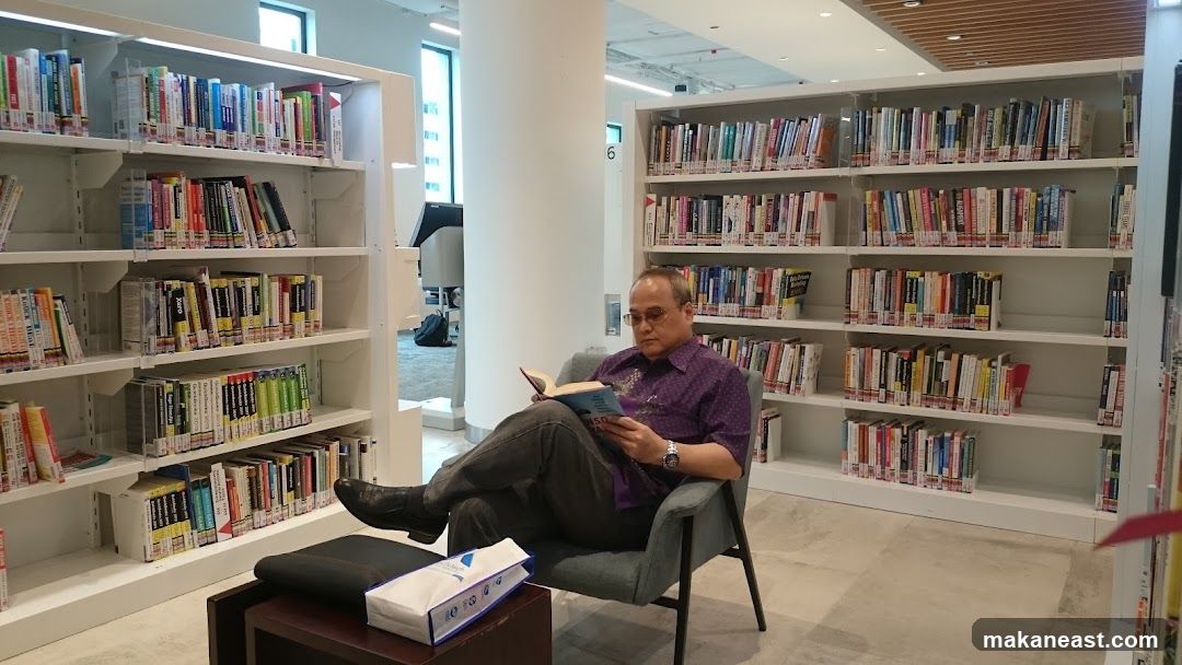 Man Reading in Library