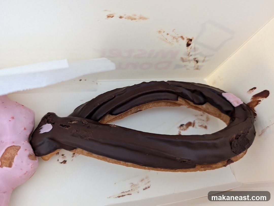 Chocolate Eclair and Pink Frosted Pastry