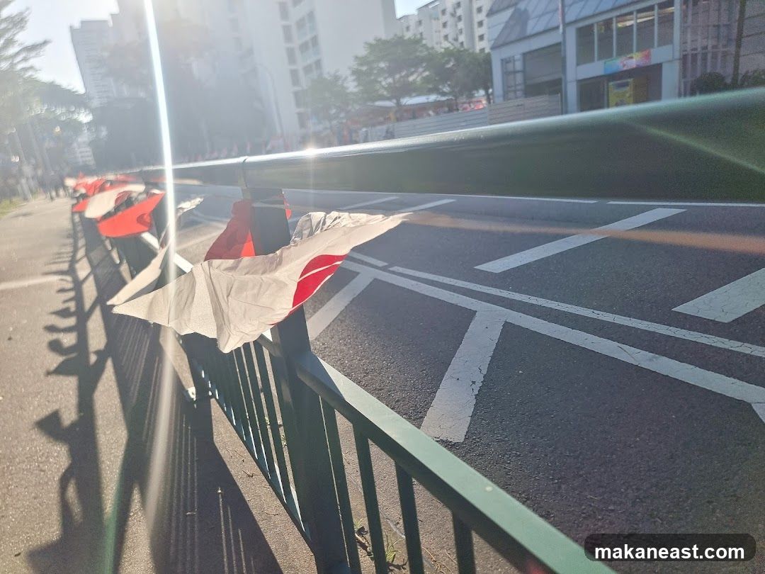 Street with flags and sun glare
