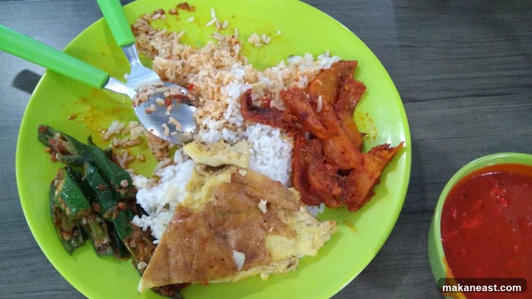 Plate of food with rice, fried chicken, omelet, and okra