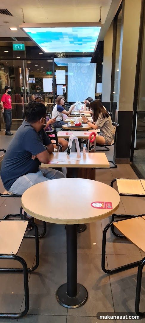 Diners at tables inside a restaurant