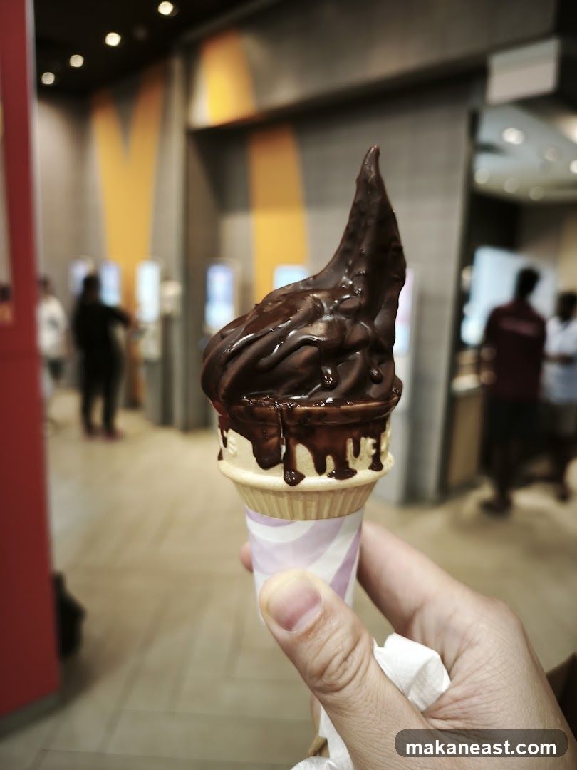 Chocolate soft serve ice cream cone