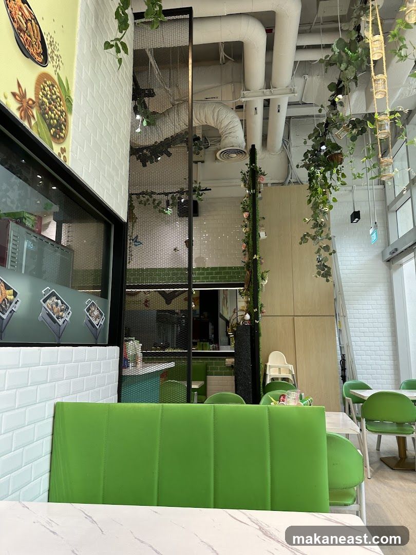 Restaurant Interior with Green Seating and Hanging Plants