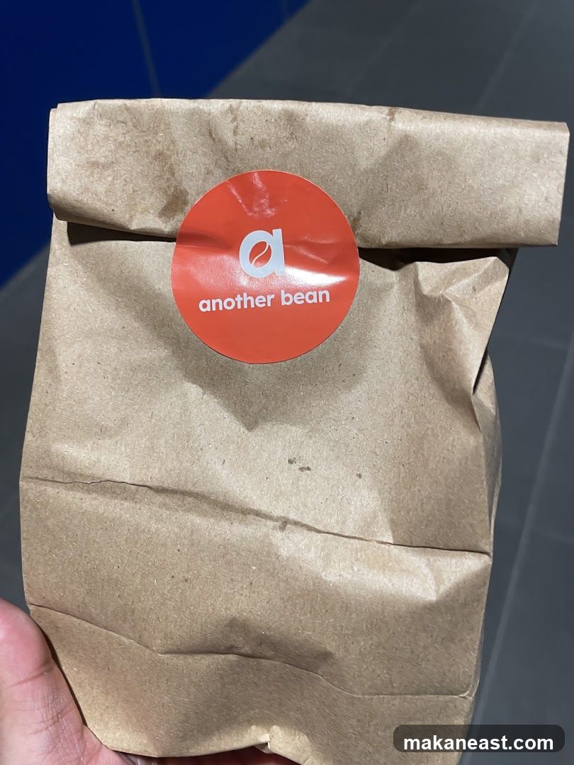 Brown paper bag with "another bean" logo