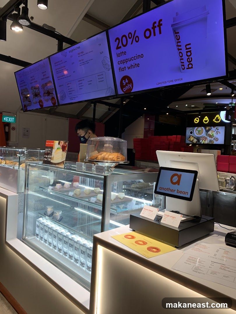 Cafe Counter with Digital Menu and Pastries