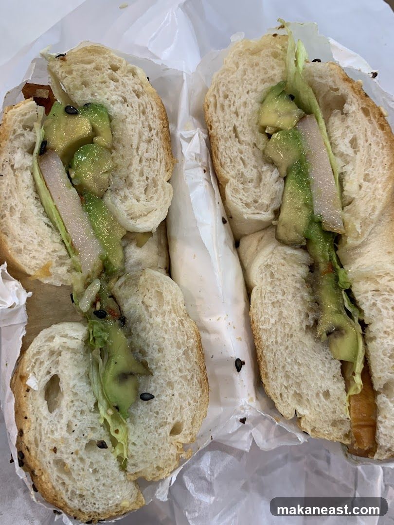 Bagel sandwich with avocado and lettuce