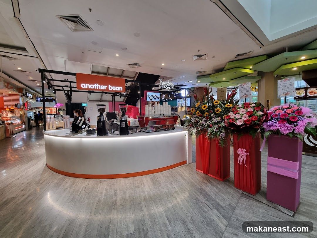 Coffee shop counter with floral arrangements