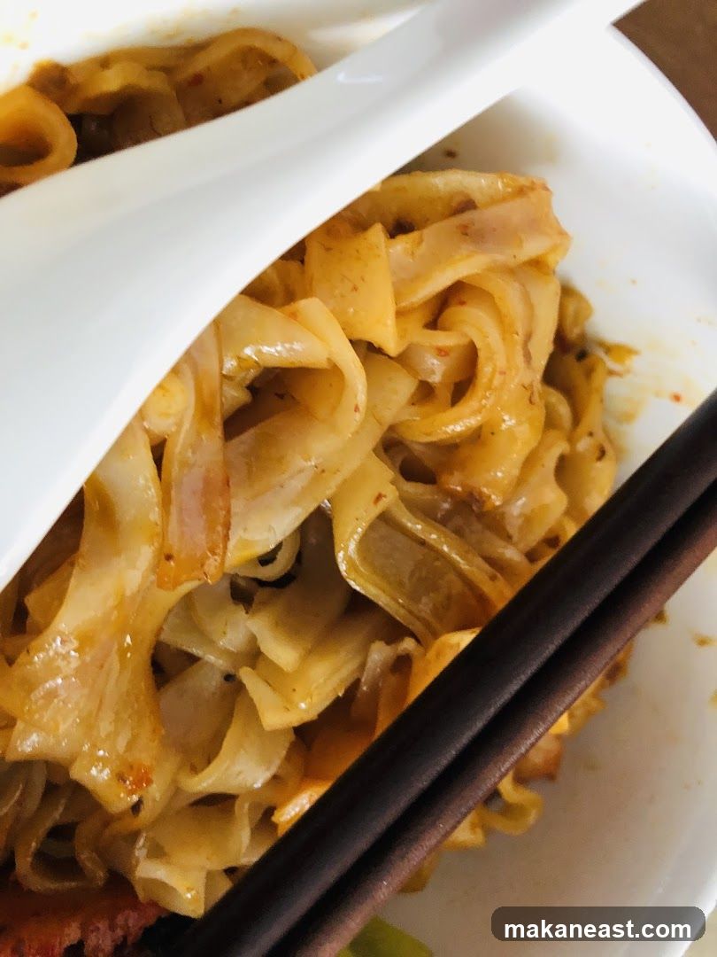 Noodles with Chopsticks and Spoon