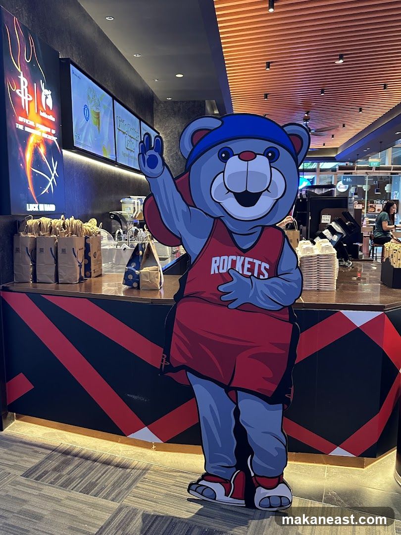Cardboard cutout of a mascot in a store