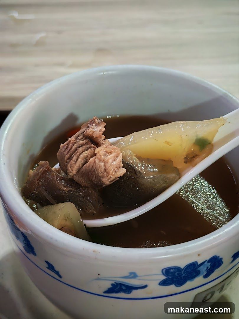 Bowl of Soup with Meat and Vegetables
