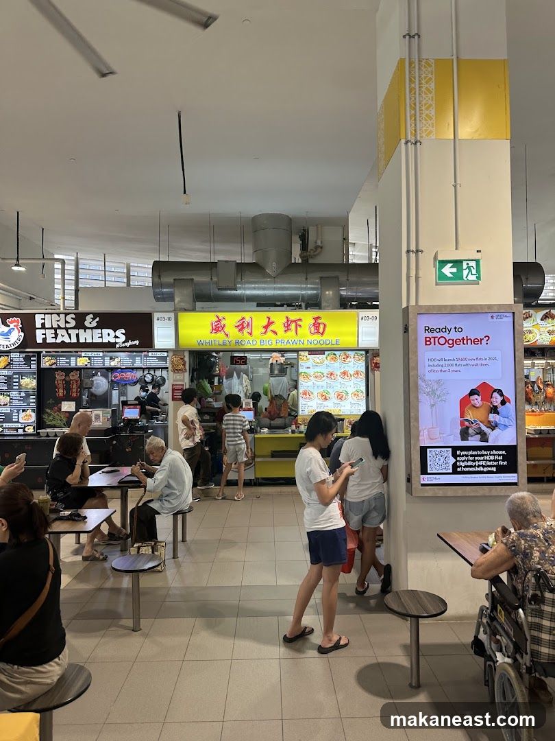 Food court with various stalls and patrons