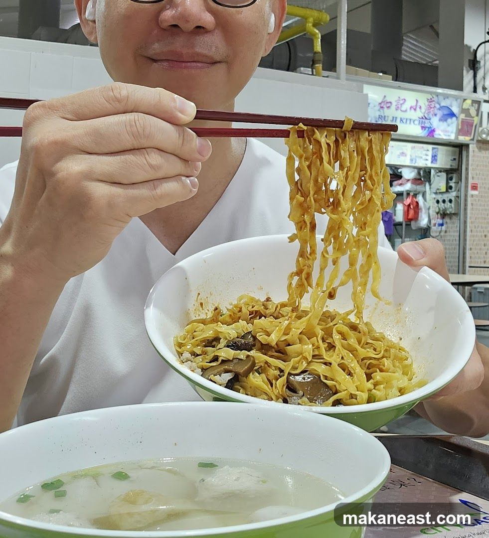 Person eating noodles