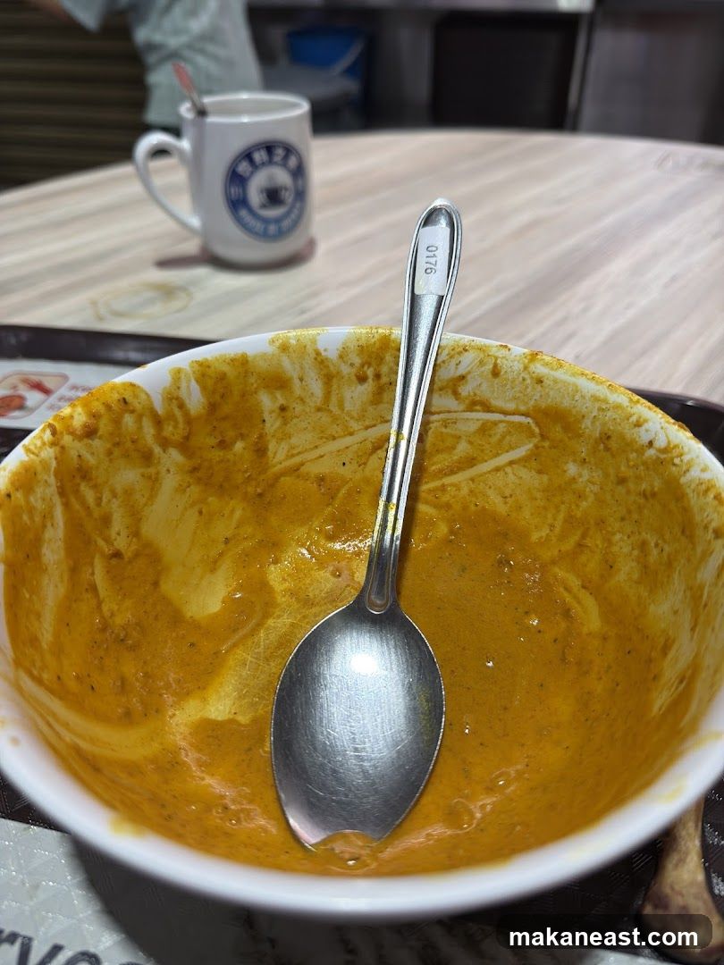 Spoon in a bowl of curry