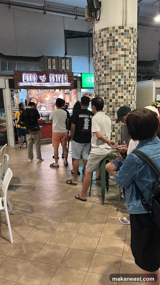 People queuing at a food stall