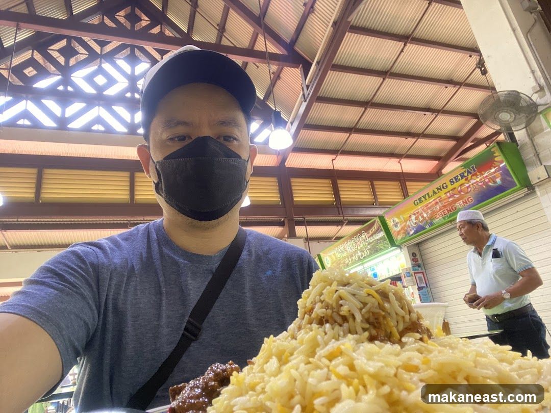 Man with a large plate of rice