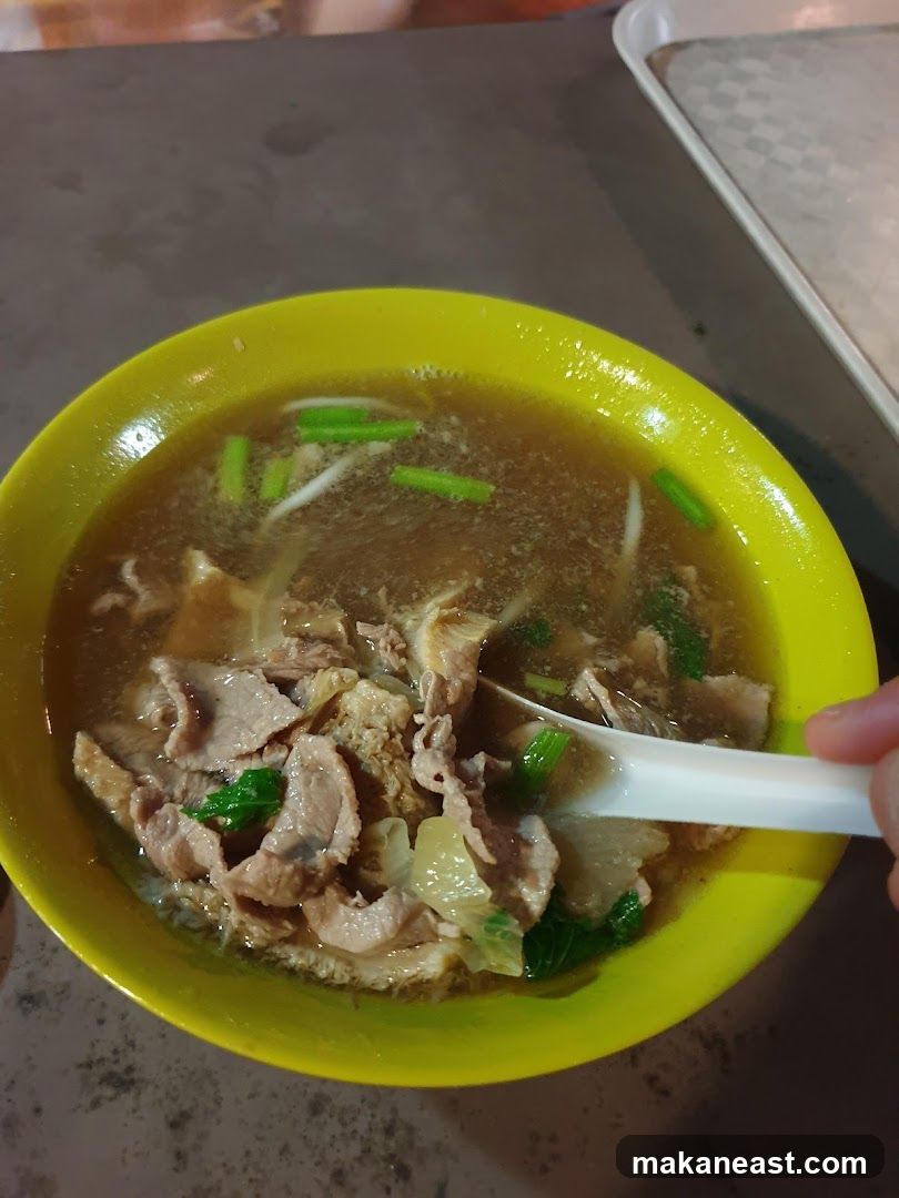 Bowl of Soup with Sliced Meat