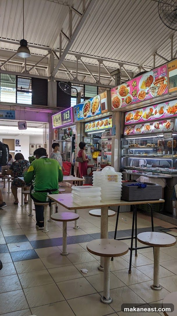 Food court stalls with displayed menus