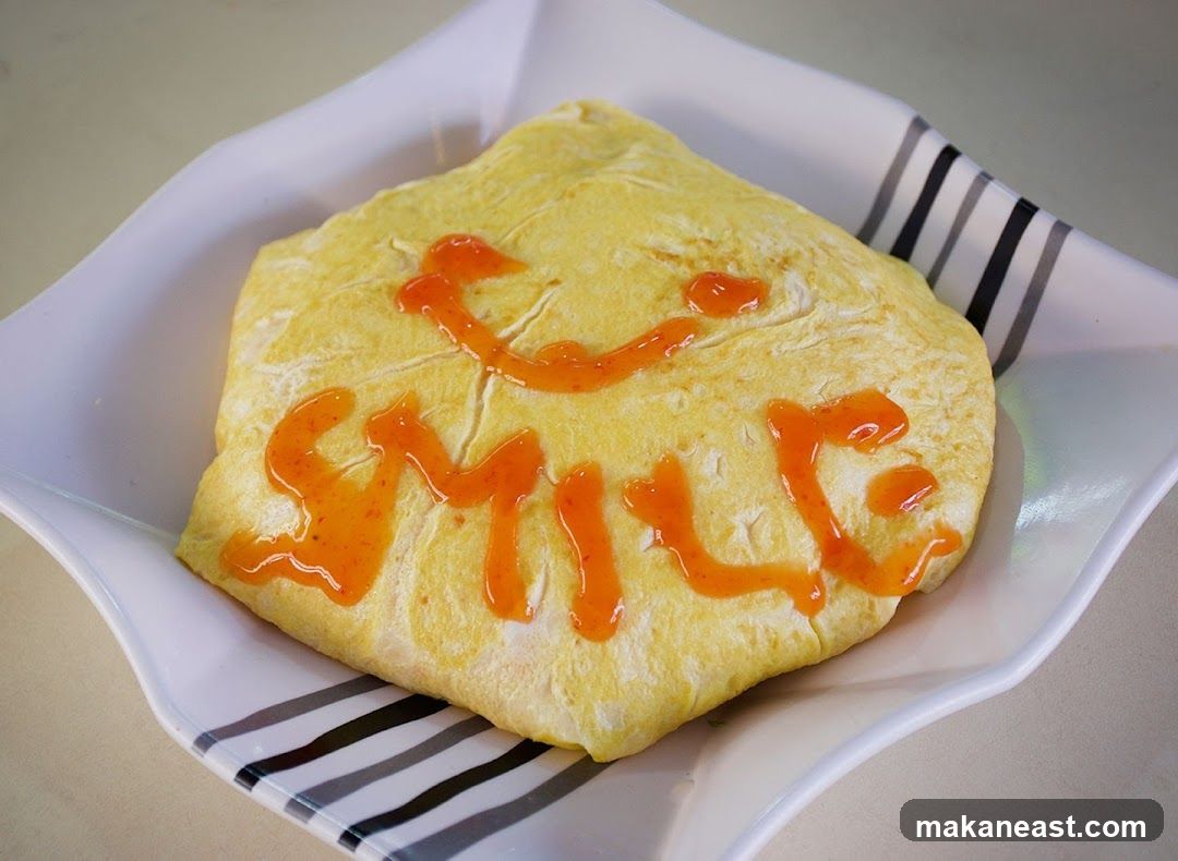 Omelet with "Smile" written in sauce