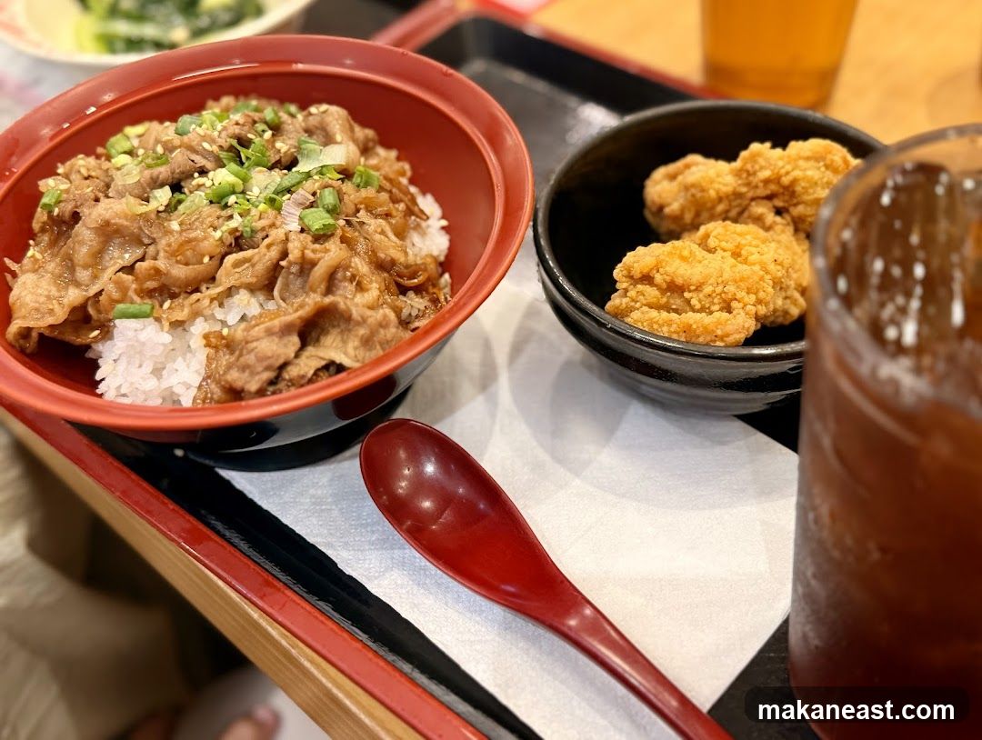 Beef bowl with fried chicken and iced tea