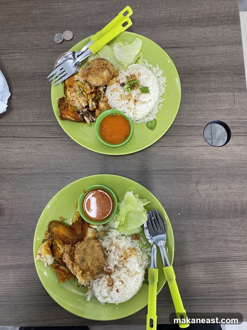 Two plates of chicken rice