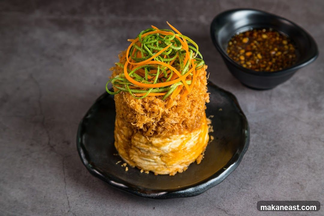 Crispy Fried Dish with Shredded Vegetables and Dipping Sauce