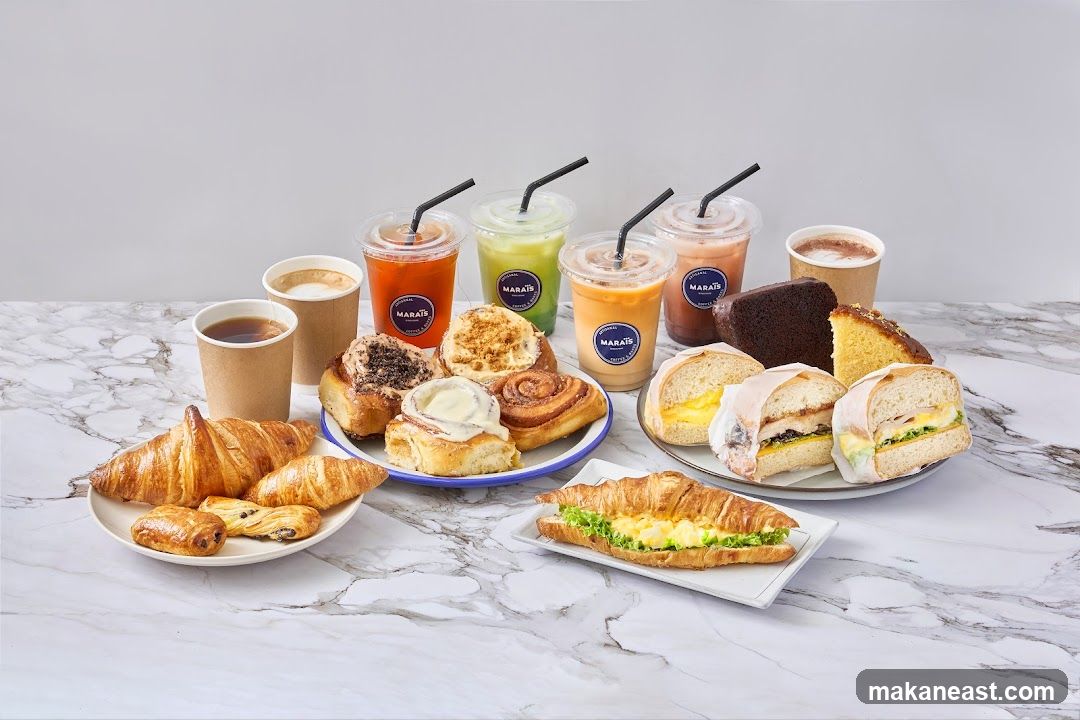 Assortment of Pastries, Sandwiches, and Drinks