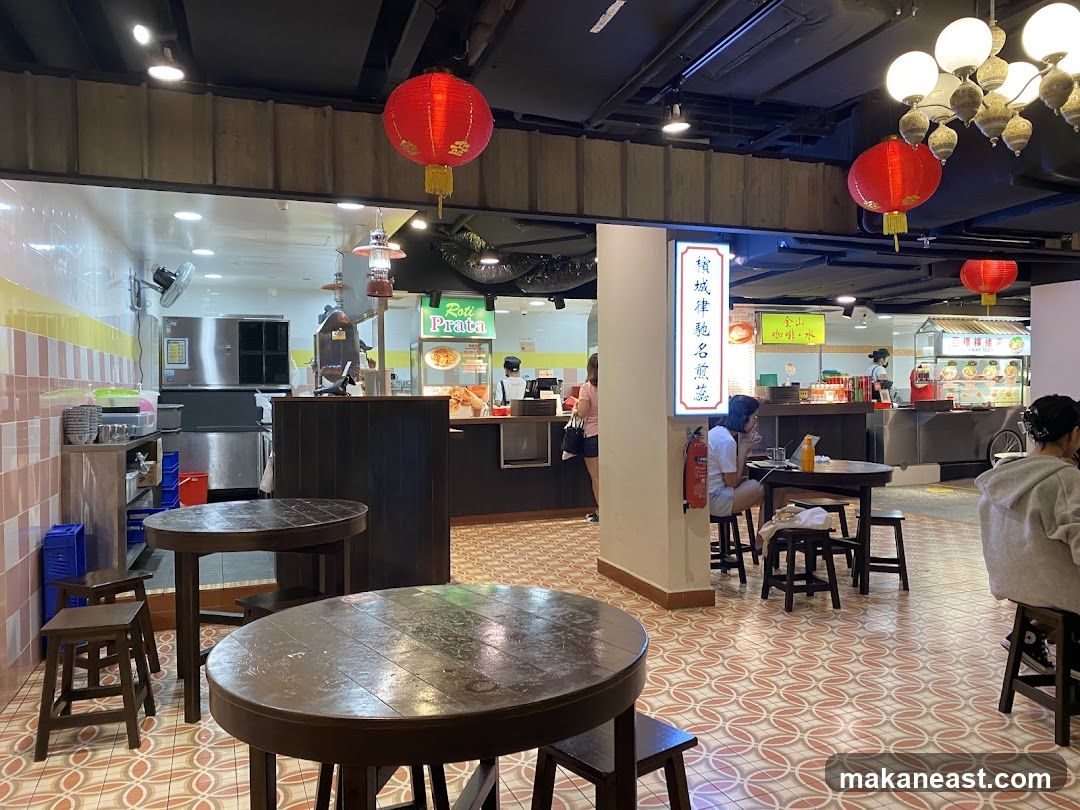 Food court interior with tables and food stalls