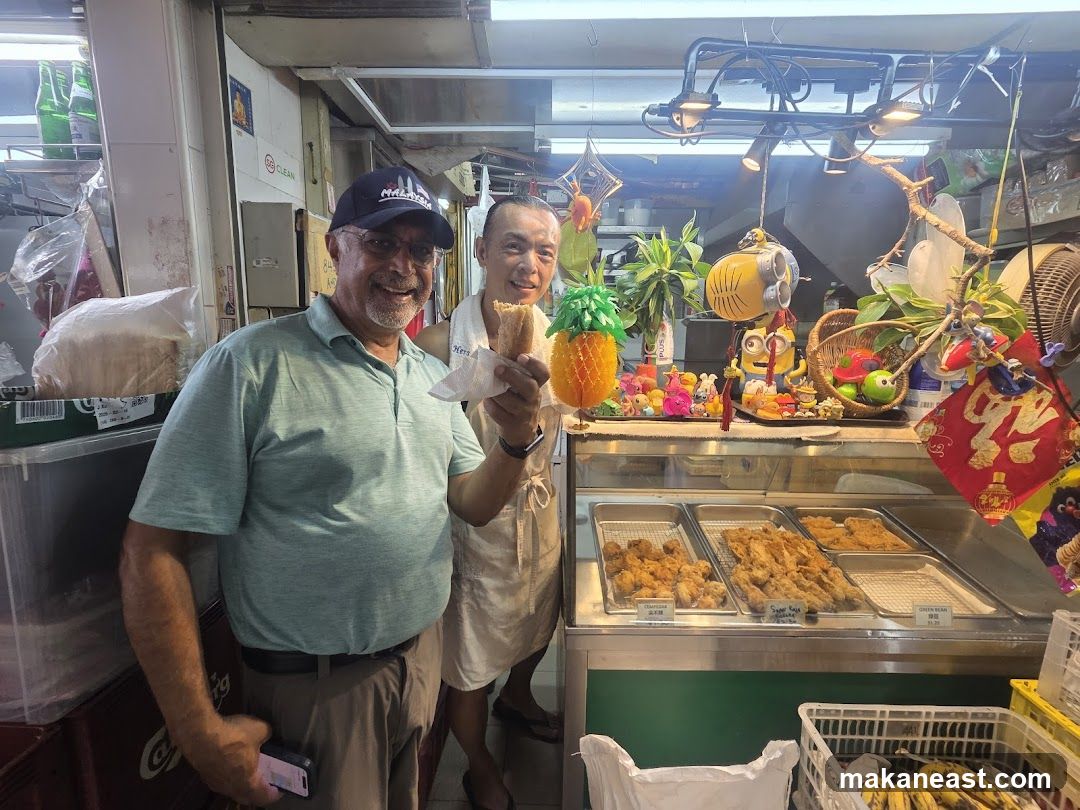 Two Men at a Food Stall