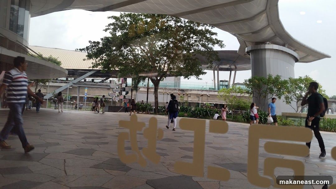 People walking in a modern outdoor plaza
