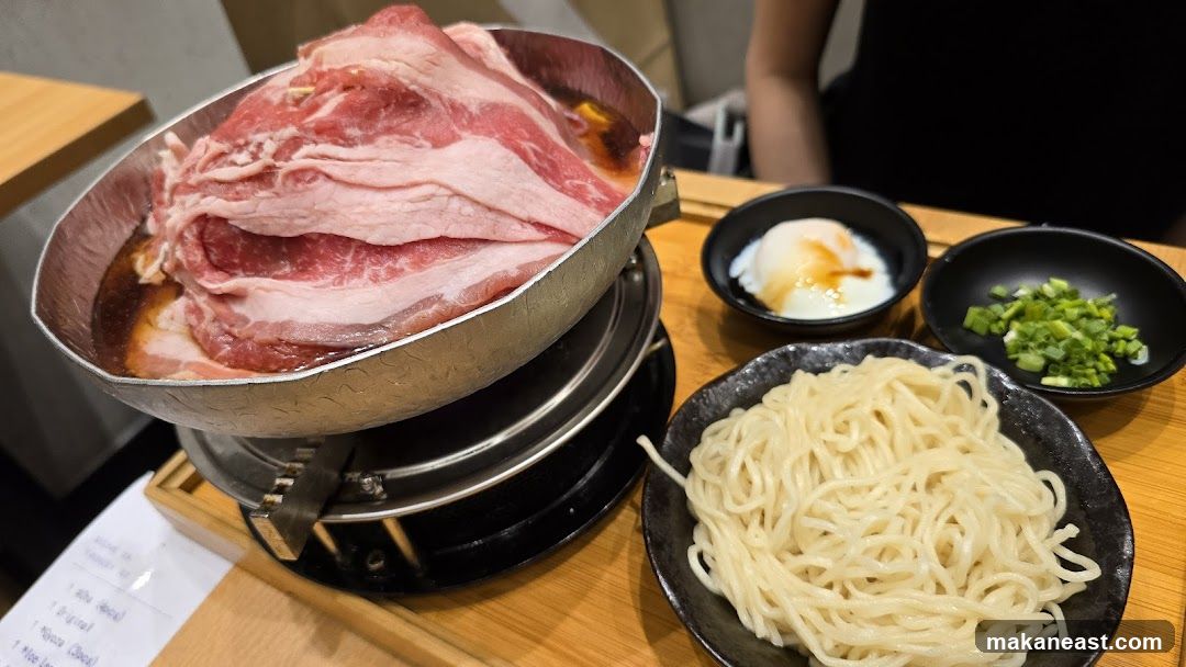 Shabu-shabu with thinly sliced beef, noodles, and egg